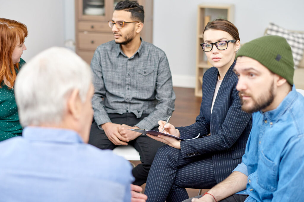 Addiction support group talking about the most addictive drugs